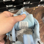 Light blue sneaker interior label with size and "BALENCIAGA" text