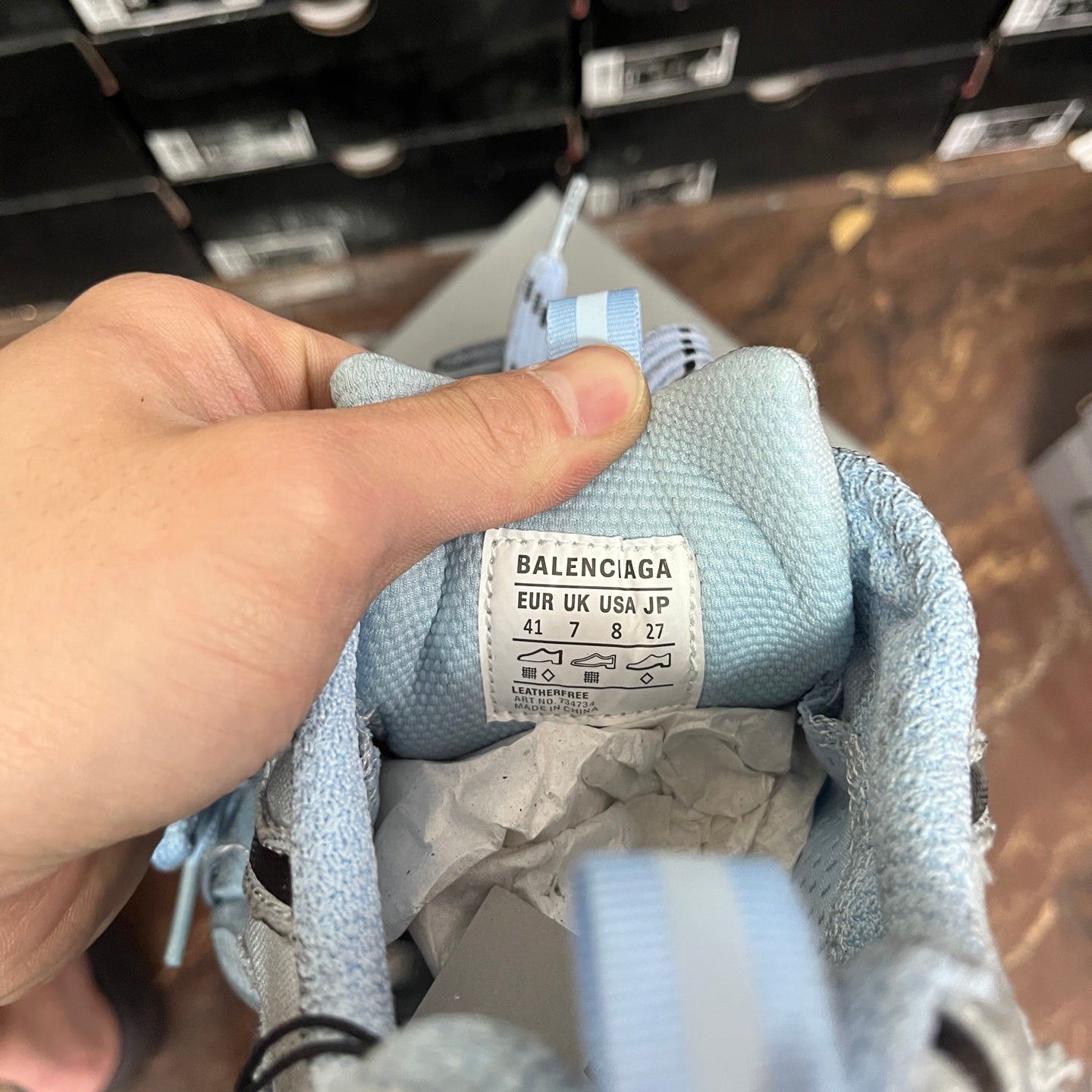 Light blue sneaker interior label with size and "BALENCIAGA" text