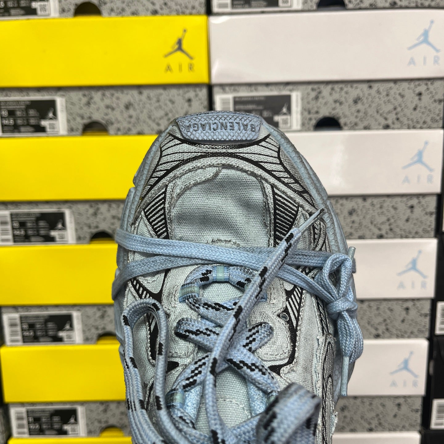 Light blue lace-up sneaker upper with mesh panels and padded tongue