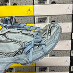 Light blue sneakers side view with lace-up closure and sculpted midsole