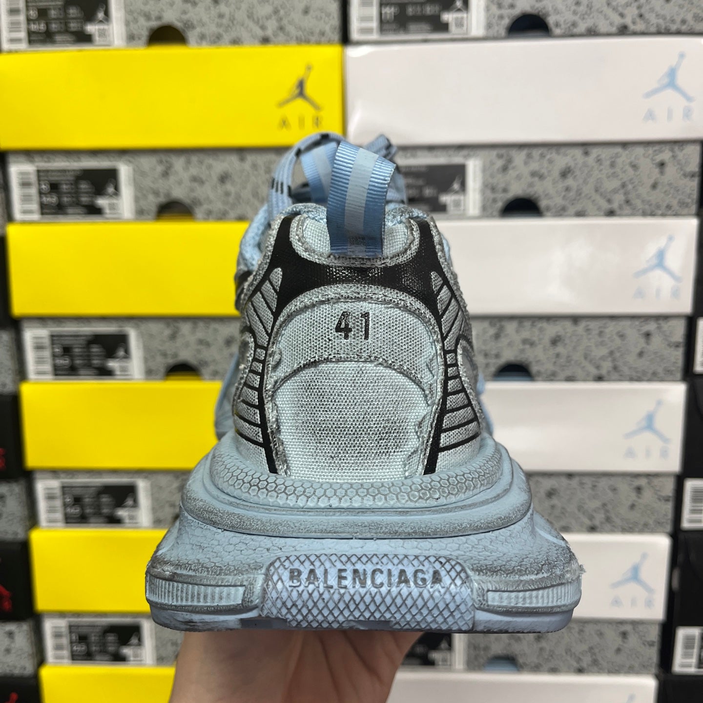 Light blue sneaker heel with "Balenciaga" text on the midsole