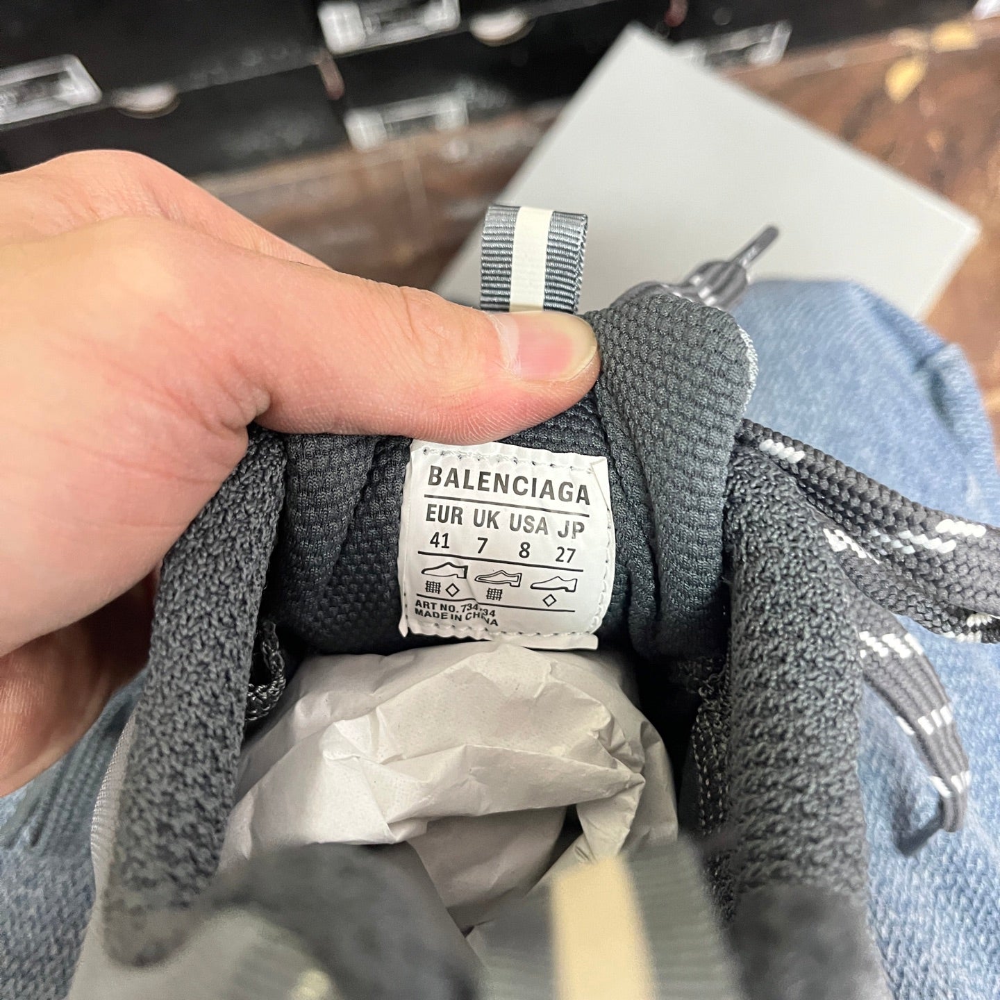 Size label inside gray sneaker: BALENCIAGA with EUR/UK/US/JP sizes