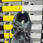 Gray knit shoe heel with pull tab and patterned black-and-white laces
