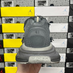 Gray rear view of lace-up sneaker with padded collar and thick sole