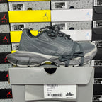 Gray lace-up athletic sneaker with side logo detail and cushioned midsole