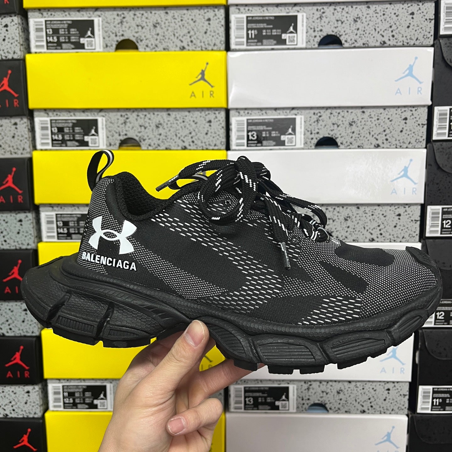 Black lace-up knit sneakers with chunky rubber sole and Balenciaga logo on side