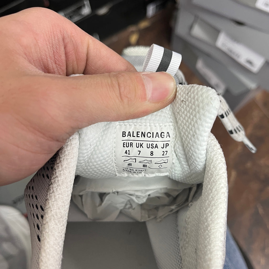 Balenciaga shoe size label inside, UK/EUR/JP sizing text on cream fabric