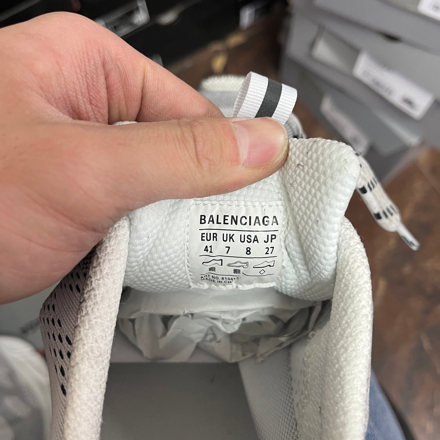 Balenciaga shoe size label inside, UK/EUR/JP sizing text on cream fabric