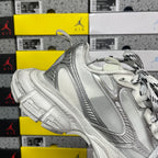 Balenciaga unisex silver sneakers, quarter view with side logo panel
