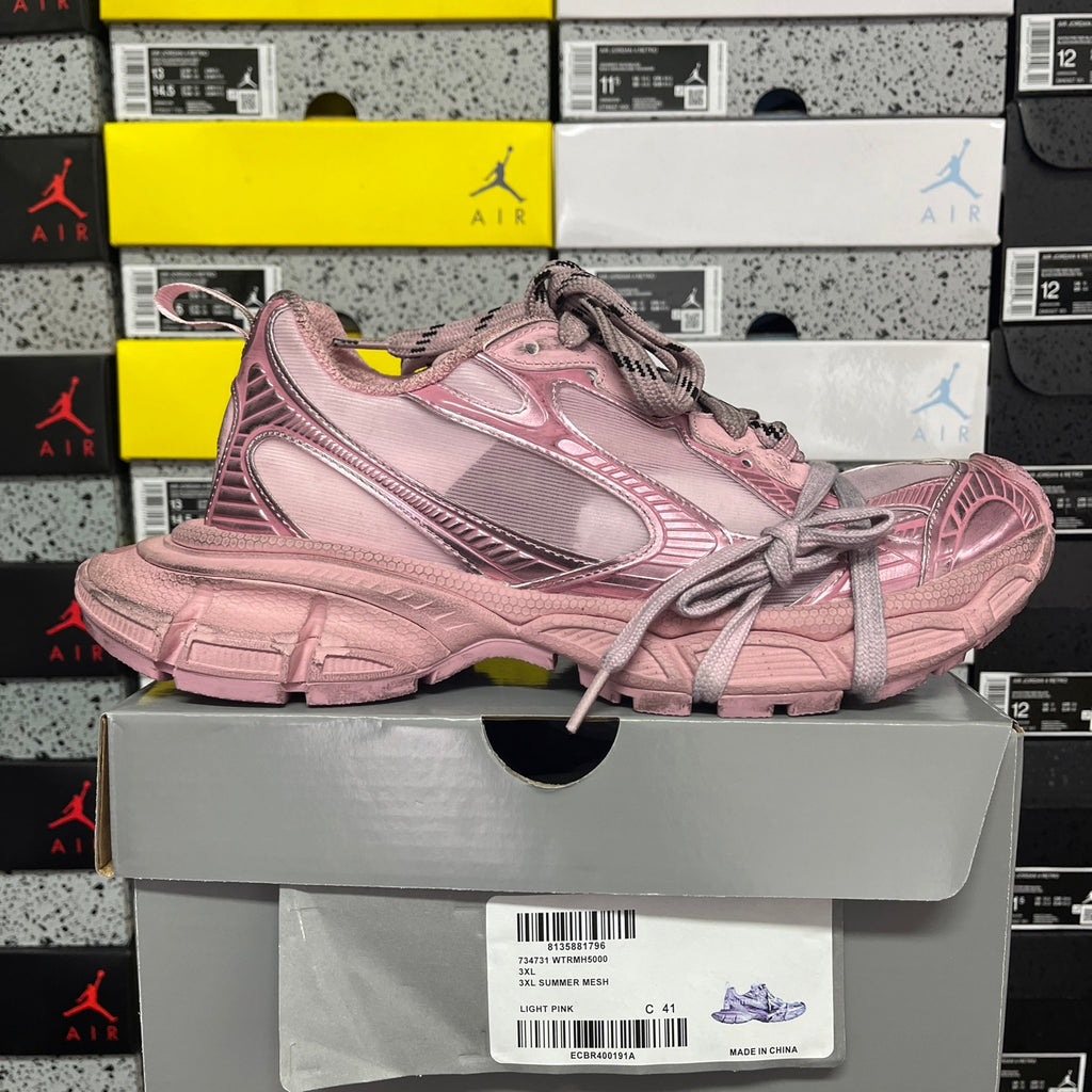 Balenciaga unisex sneaker in pink with lace-up front and chunky tread sole.