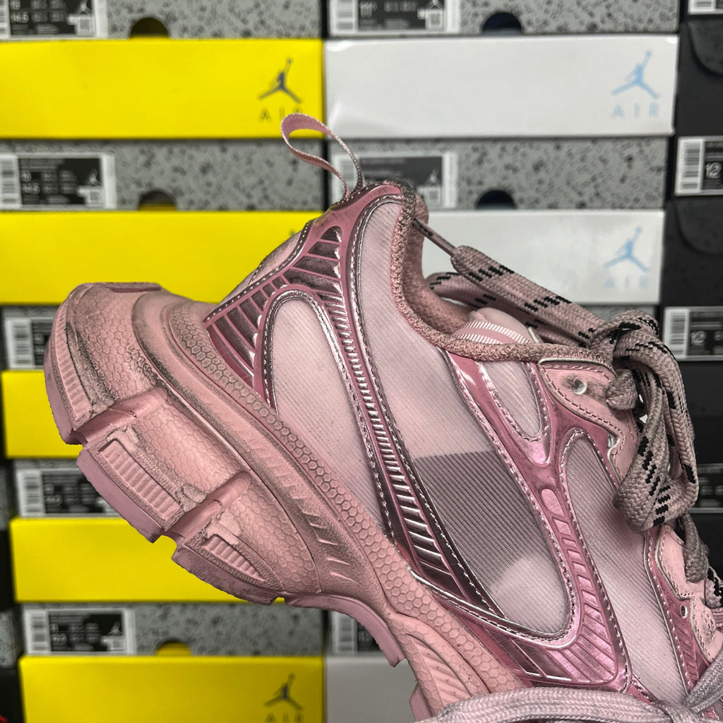 Balenciaga unisex sneaker heel-side view in pink with lace-up and textured overlay.