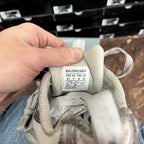 Balenciaga unisex sneaker tongue label with size info in gray fabric.