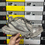 Balenciaga unisex gray sneaker with lace-up front and textured rubber sole.