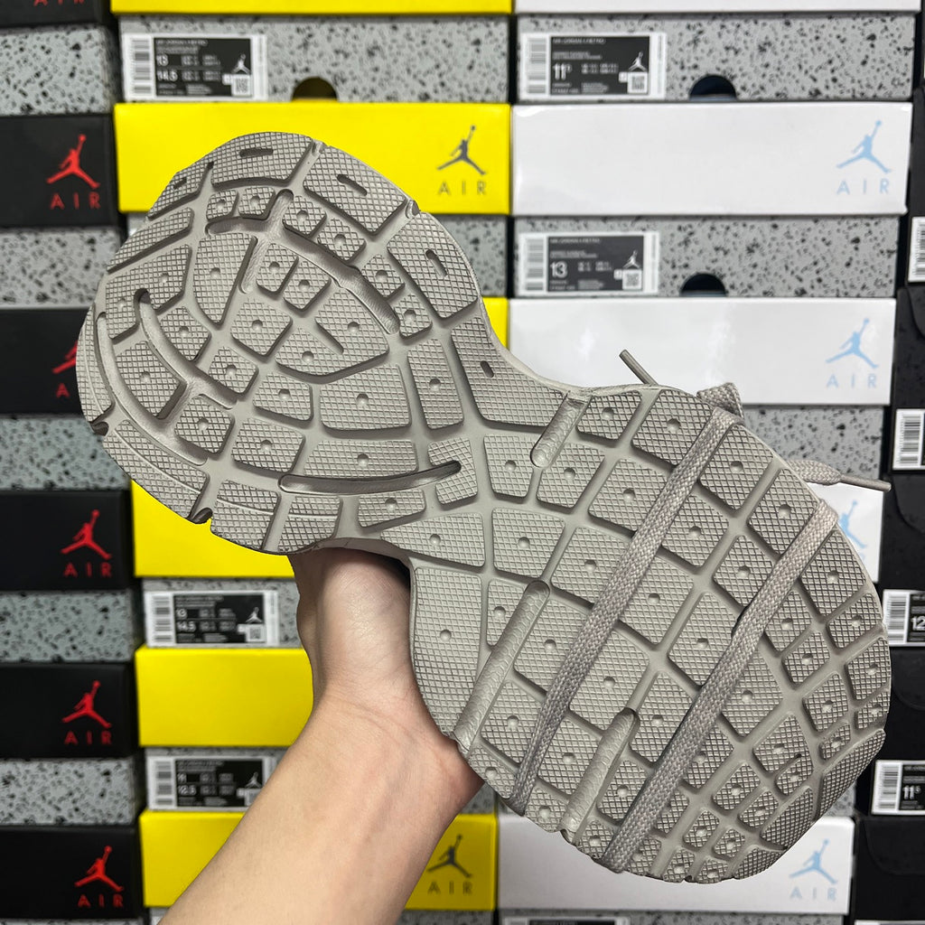 Balenciaga unisex gray sneaker outsole with traction tread pattern.