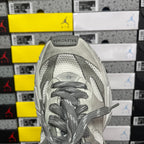 Balenciaga sneaker front view with gray laces and perforated toe panel on light gray upper