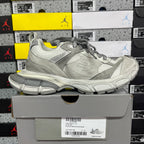 Balenciaga low-top sneaker in light gray with lace-up closure and textured panel details