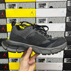 Grey sport sneaker front-side view with black laces and chunky sole