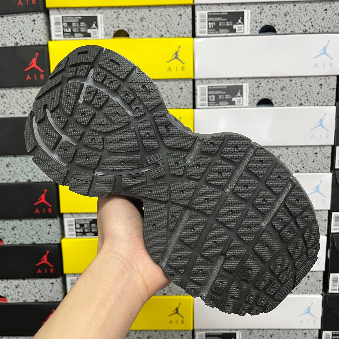 Grey sneaker outsole with deep tread pattern for grip
