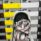 Balenciaga unisex sneaker toe, white laces with red accents on gray knit