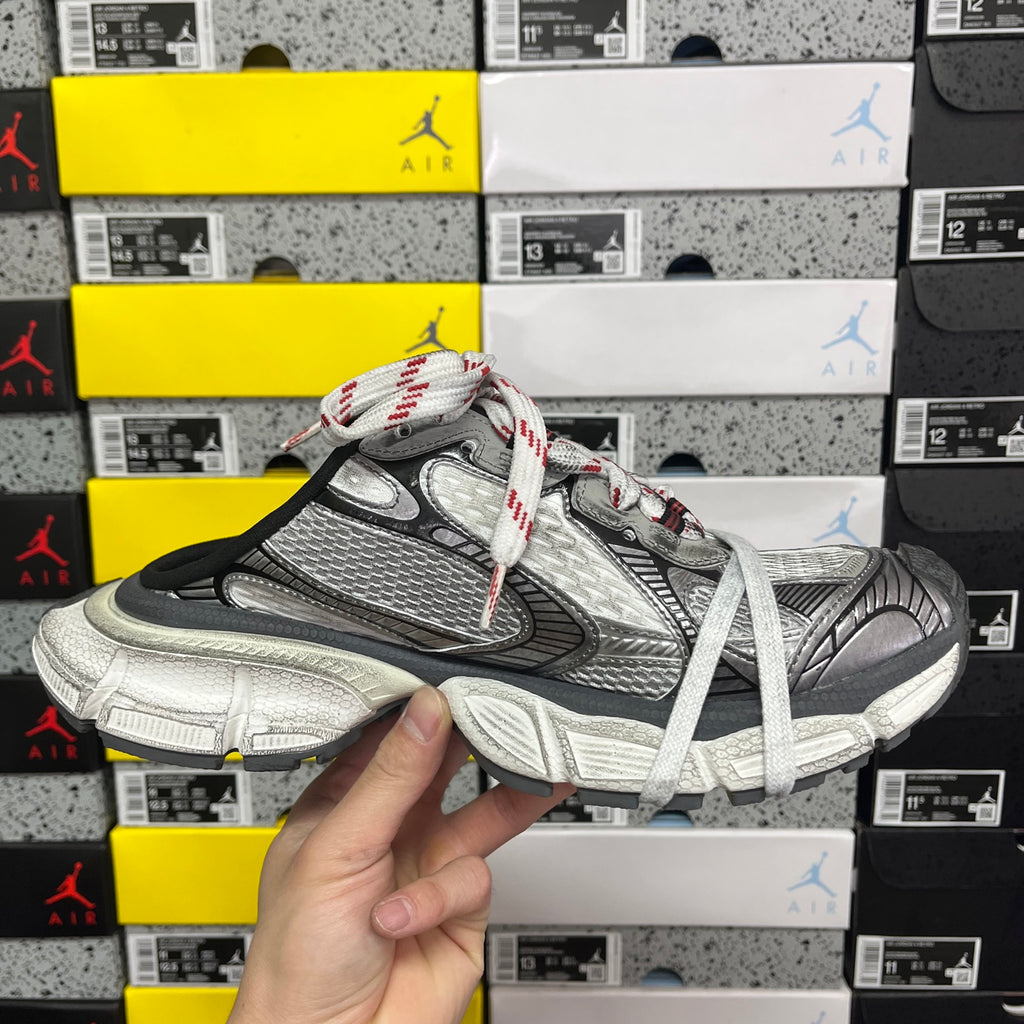 Balenciaga unisex sneaker front view, gray and black panels with white laces