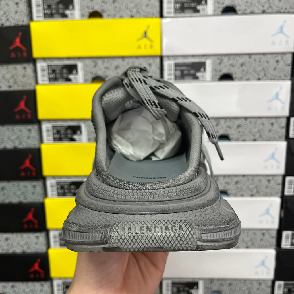 Gray sneaker heel with “BALENCIAGA” branding and padded collar