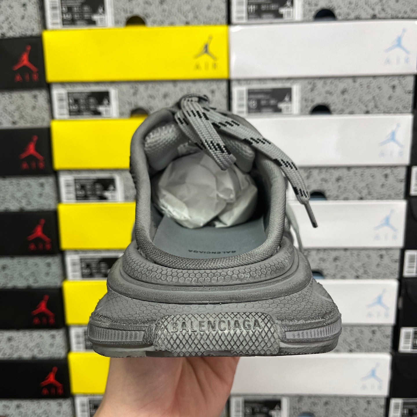 Gray sneaker heel with “BALENCIAGA” branding and padded collar