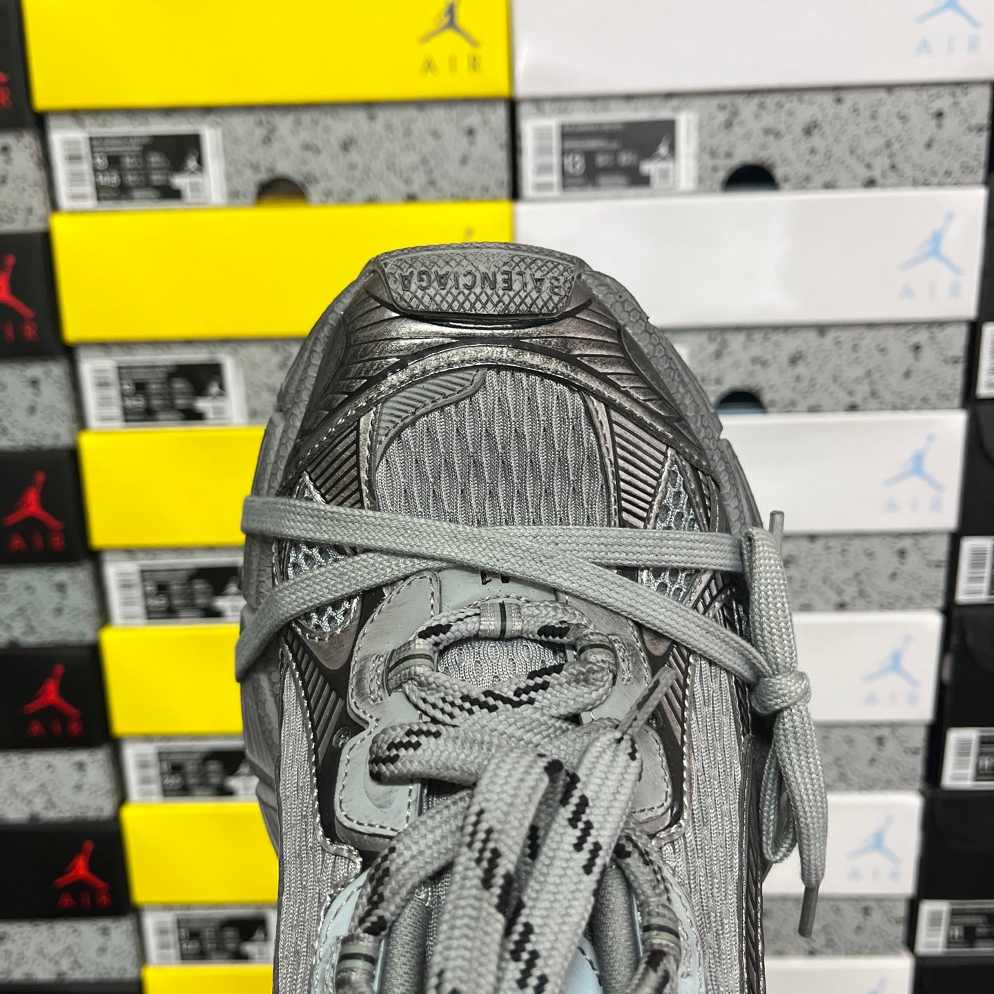 Gray sneaker toe with mesh upper and lace pattern detail