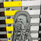 Gray sneaker heel with padded collar and lace-up opening
