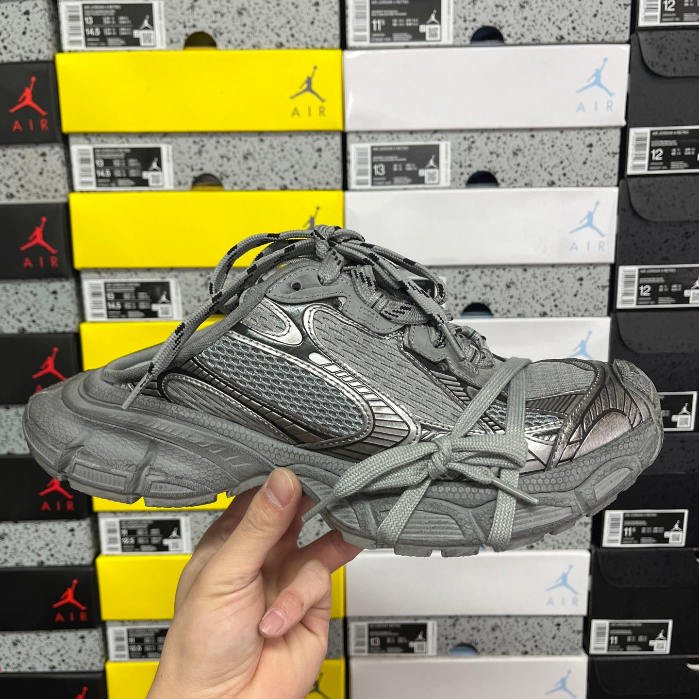 Gray mesh and leather-style unisex sneakers with lace-up front and sculpted sole