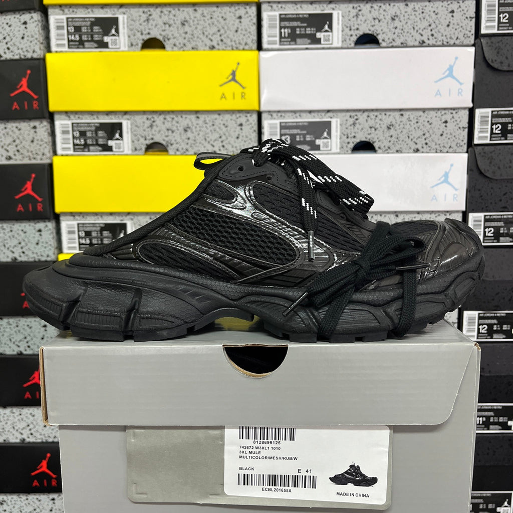 Black lace-up sneakers with mesh and synthetic overlays and chunky outsole