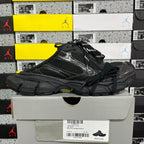 Black lace-up sneakers with mesh and synthetic overlays and chunky outsole