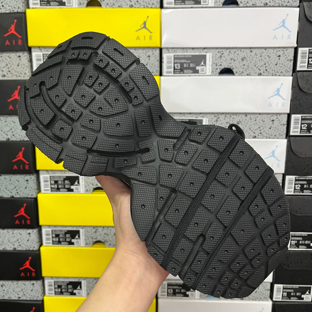 Balenciaga unisex sneakers, black tread outsole with molded traction pattern