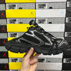 Balenciaga unisex sneakers, three-quarter front view with black and white paneling