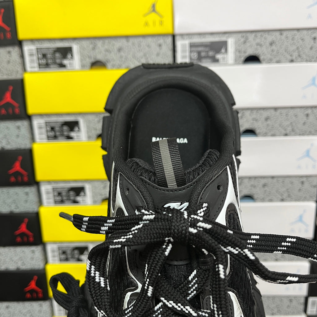 Balenciaga unisex sneakers, close-up of tongue and lace area in black and white