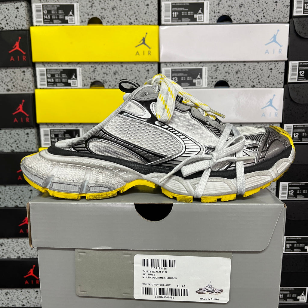 Balenciaga unisex sneakers side view in silver-gray, black detailing, yellow trim, white laces