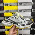 Balenciaga unisex sneakers in silver-gray with black panels and yellow accents, white laces