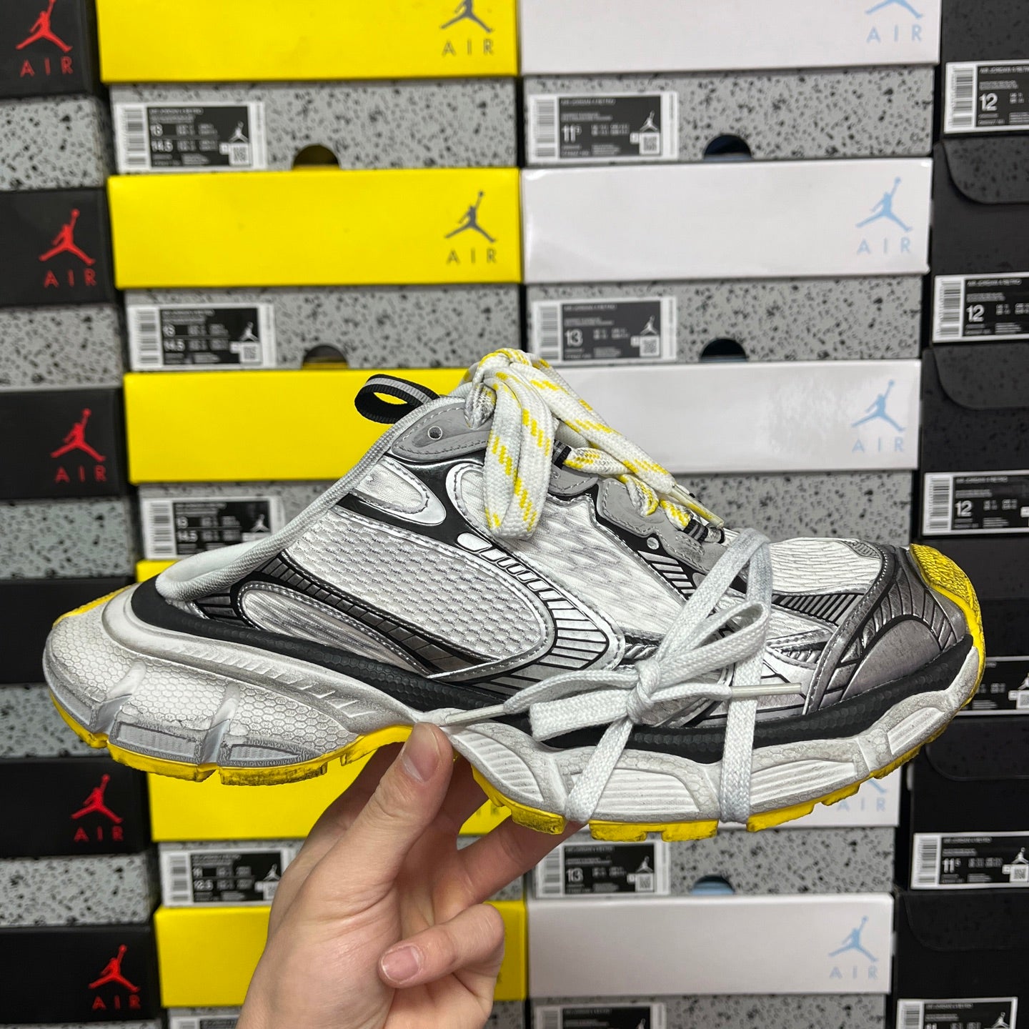Balenciaga unisex sneakers in silver-gray with black panels and yellow accents, white laces
