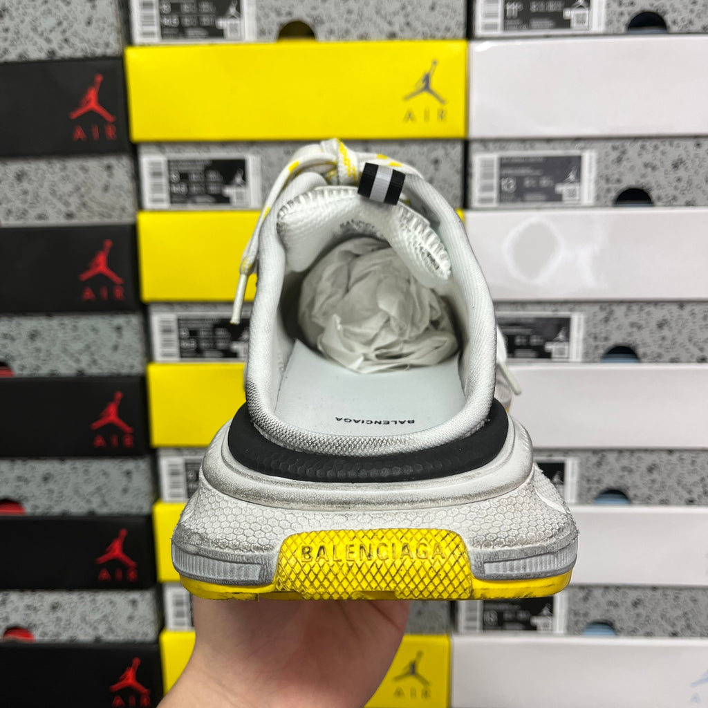 Balenciaga unisex sneakers back view with Balenciaga branding on yellow heel cap