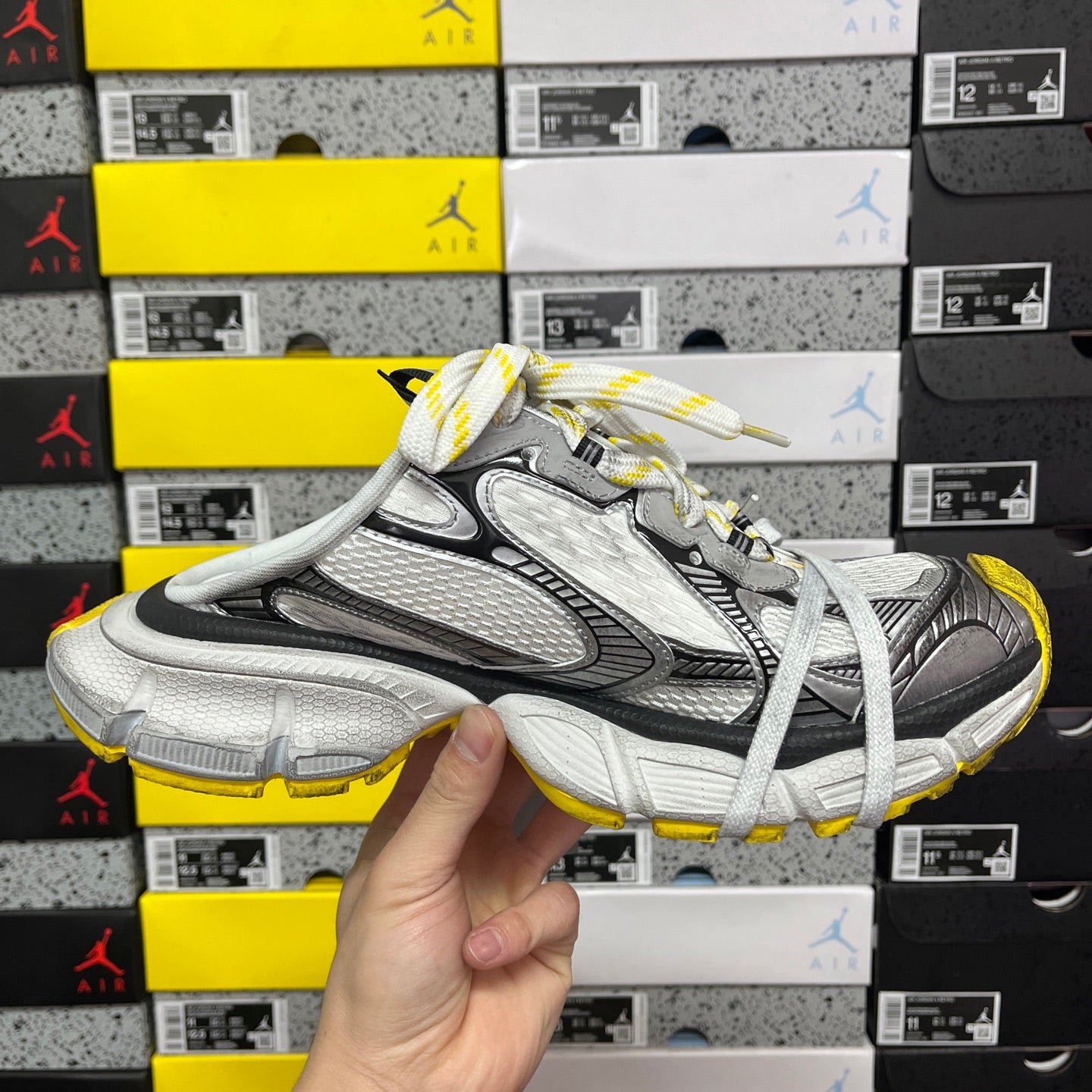 Balenciaga unisex sneakers front angle showing silver-gray mesh and black lace panel
