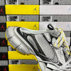 Balenciaga unisex sneakers upper close-up in silver-gray with black stripe and white laces