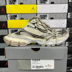 Off-white Balenciaga unisex sneakers on box, side view with lace-up closure