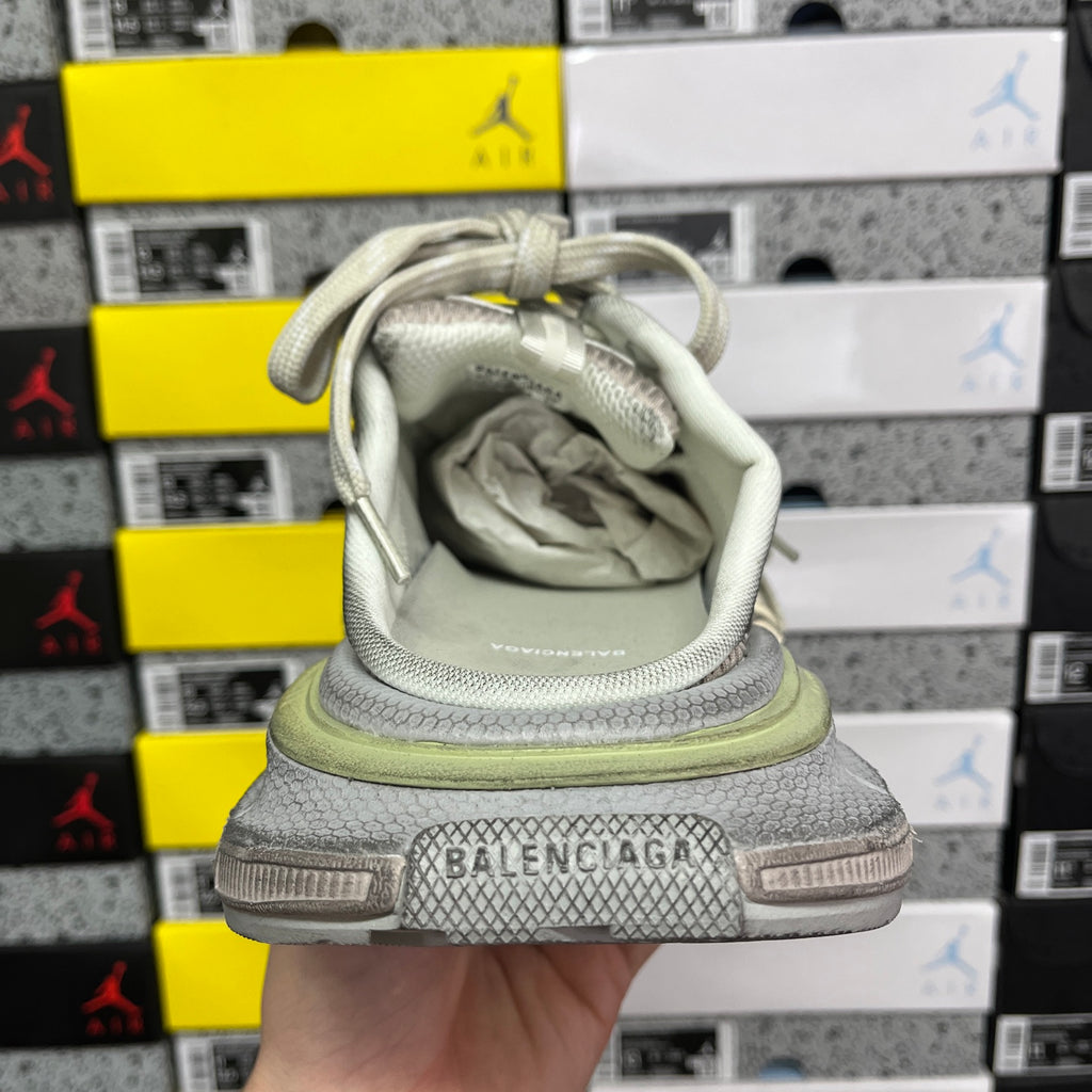 Light gray sneaker heel with BALENCIAGA branding and sage green midsole edge.