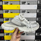 White Balenciaga lace-up sneaker, front three-quarter view with thick sole