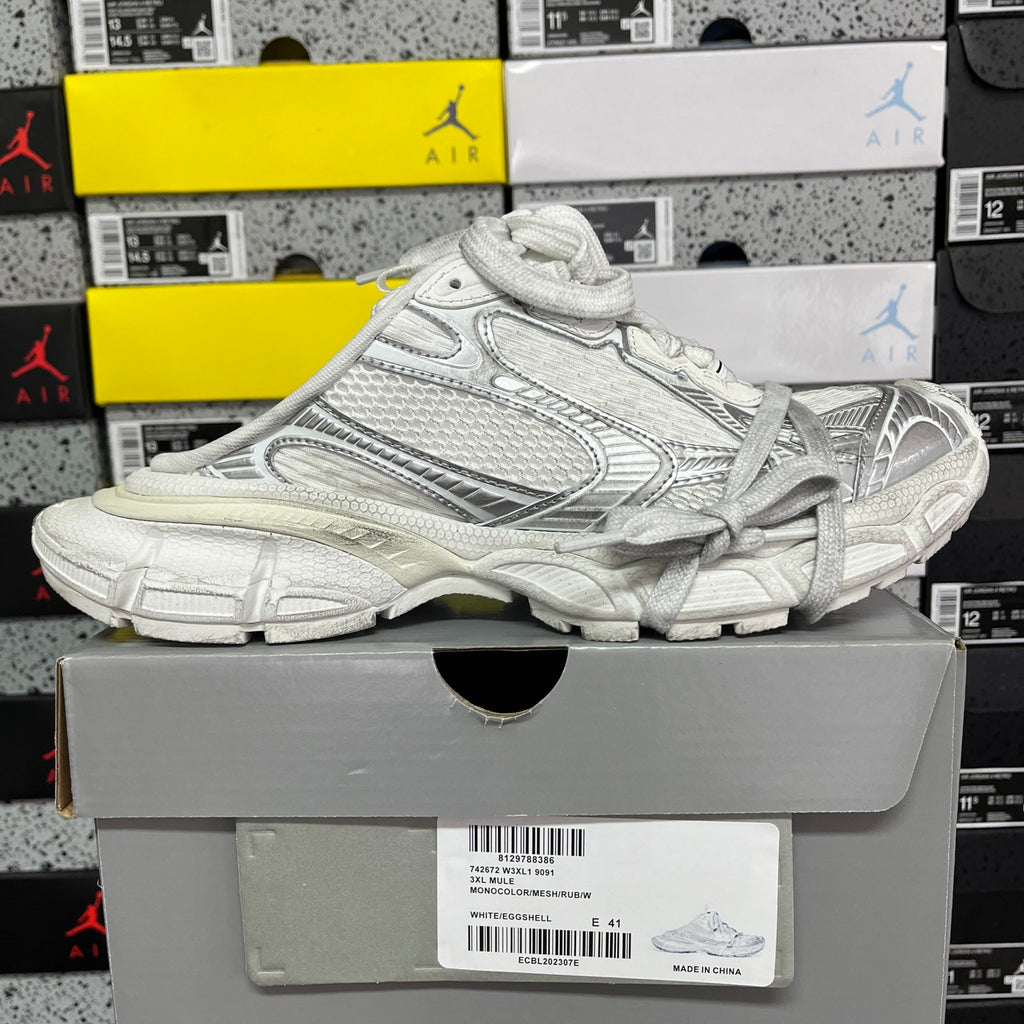 White Balenciaga sneaker on box, side view with laces and cushioned sole