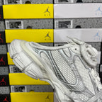 White Balenciaga sneaker on box, side profile with lace-up closure