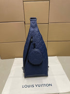Louis Vuitton monogram sling bag in dark blue with top handle and front round pouch