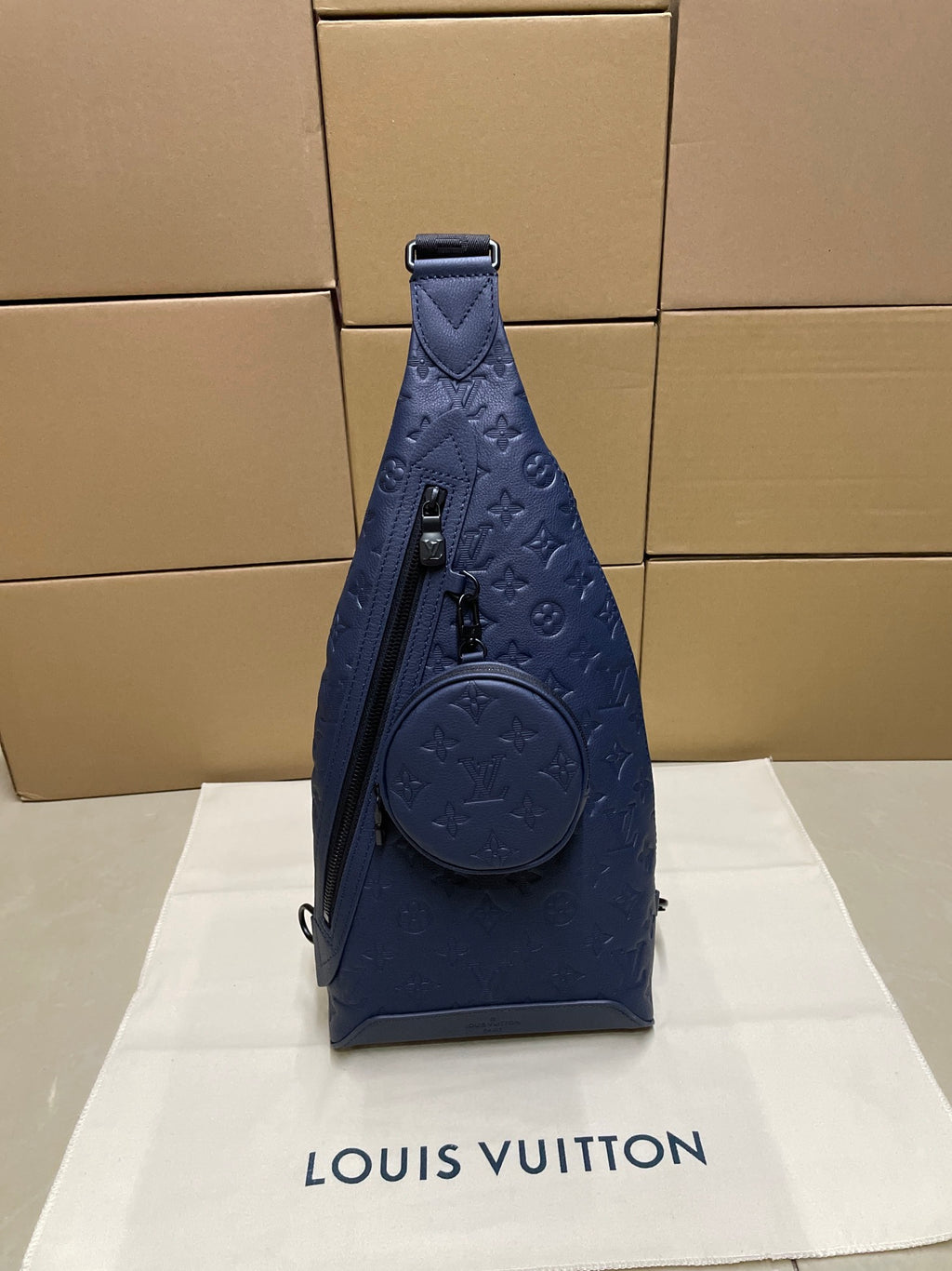 Louis Vuitton blue monogram sling bag with front round pouch and top handle