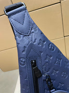 Blue monogram bag side panel with vertical zipper pull and top strap tab
