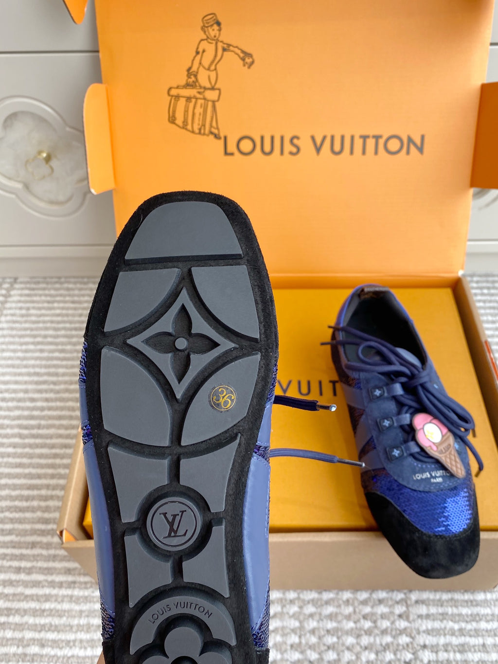 Louis Vuitton unisex sneakers, outsole detail with LV logo and blue side panel