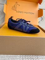 Louis Vuitton unisex sneakers, side view with blue textured uppers and black trim